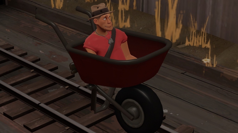 Scout in wheelbarrow.
